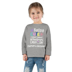 Toddler Long Sleeve Tee — "Feeling Cute, Might Throw..." Customizable